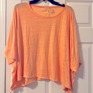 Like new! Free People movement T in tangerine. Size Small